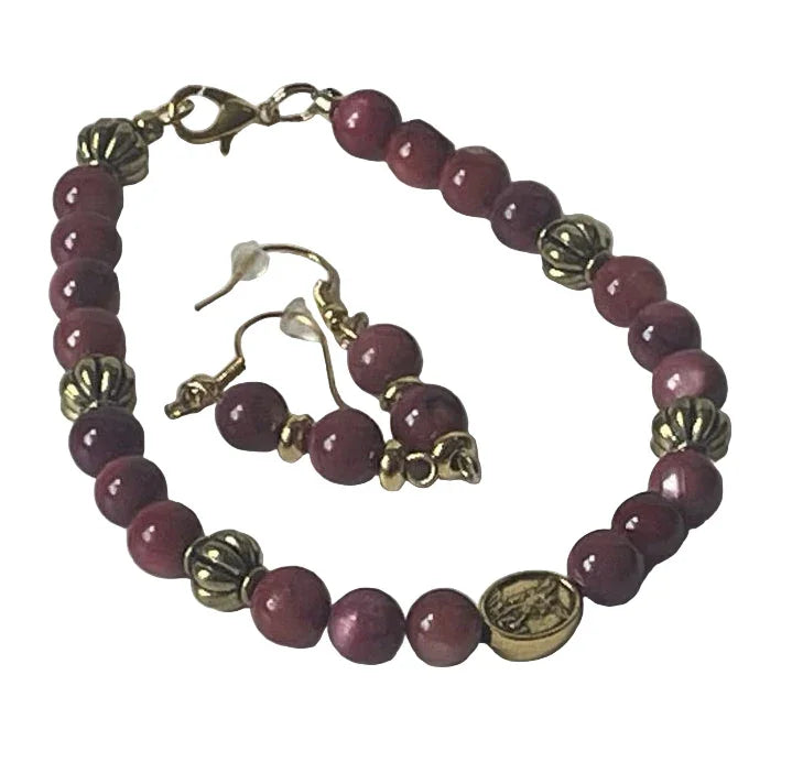 Dyed shell amethyst bracelet and gold earrings set by Sylvia Leroux featuring 7.5-inch bracelet and 2-inch earrings.