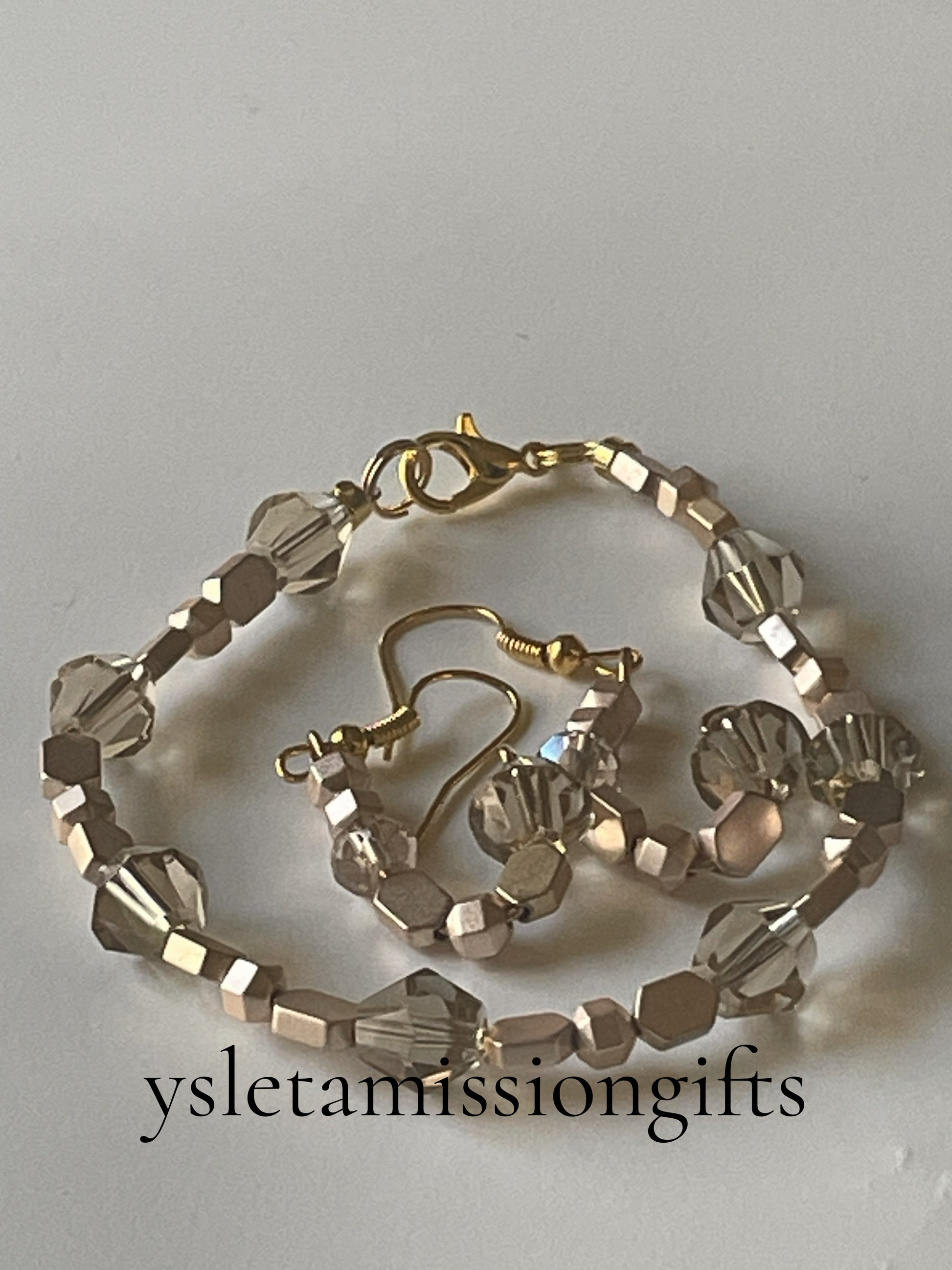Faceted light rose gold beaded bracelet and matching 8mm champagne glass bead earrings by Sylvia Leroux, 7-inch bracelet with gold lobster clasp