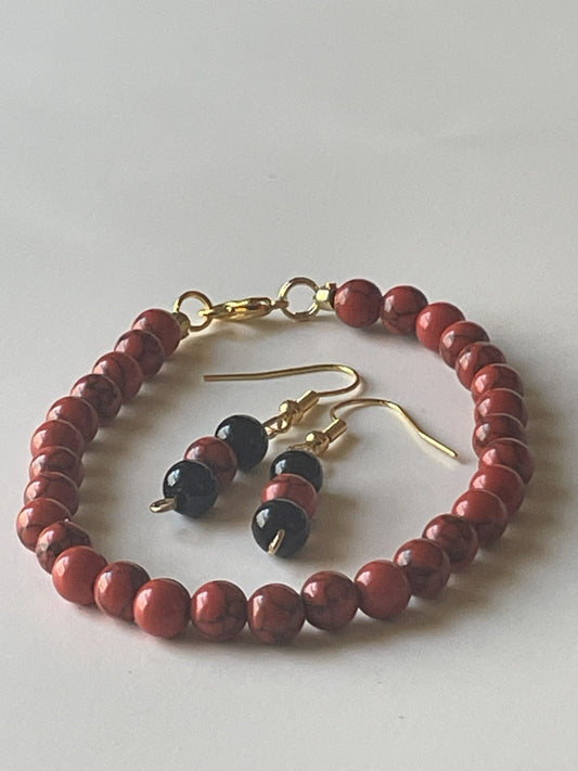 Sylvia Leroux jewelry set with 7-inch bracelet and matching earrings featuring 6mm red stone and black onyx beads, gold lobster clasp and hooks.