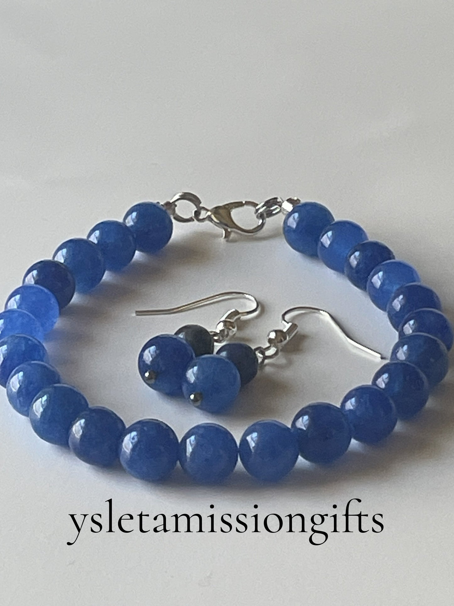 Blue Kyanite bead jewelry set featuring a 7-inch bracelet with 1-inch dangle earrings, silver lobster clasps, and earring hooks.