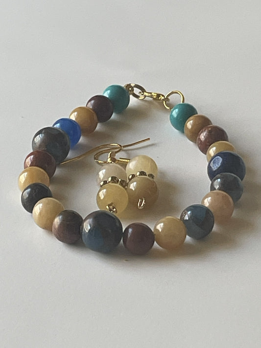 Sylvia Leroux jewelry set with 7-inch bracelet and 1-inch dangle earrings featuring 8mm mixed color and pale yellow agate beads.