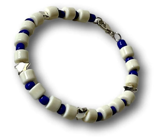 7-inch Sylvia Leroux bracelet with white acrylic cylinder beads, blue seed bead spacers, and silver star accents.