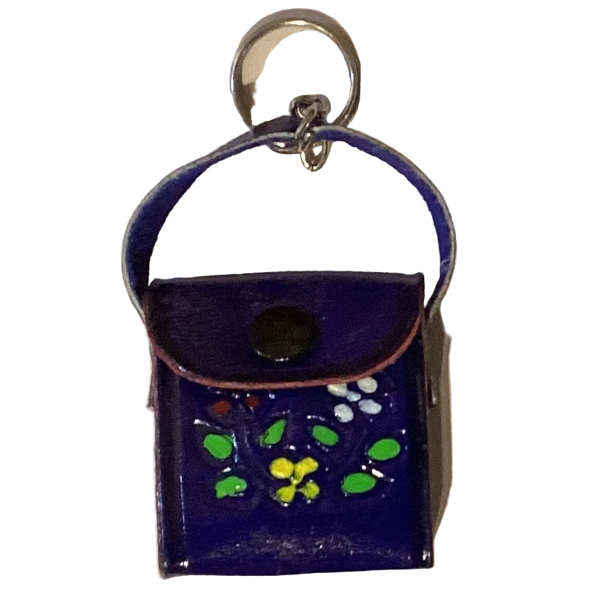 Mini leather crossbody purse keychain with western style from Ysleta Mission Gift Shop, featuring detailed stitching and compact design.