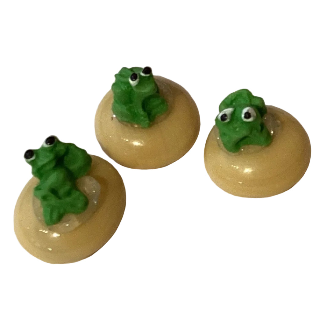Handmade ceramic frog figurine, 0.75 inches tall, from Ysleta Mission Gift Shop, suitable for home and garden decor.