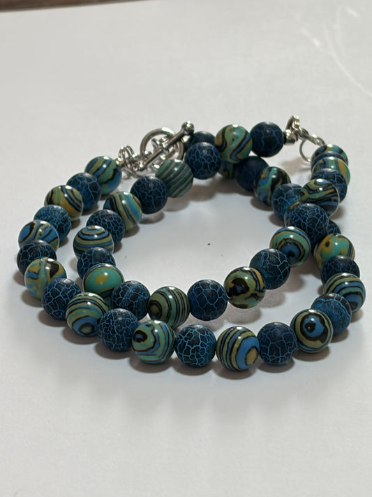 Natural round malachite couples bracelet with 8mm marbled beads, silver lobster and toggle clasps, by Sylvia Leroux.