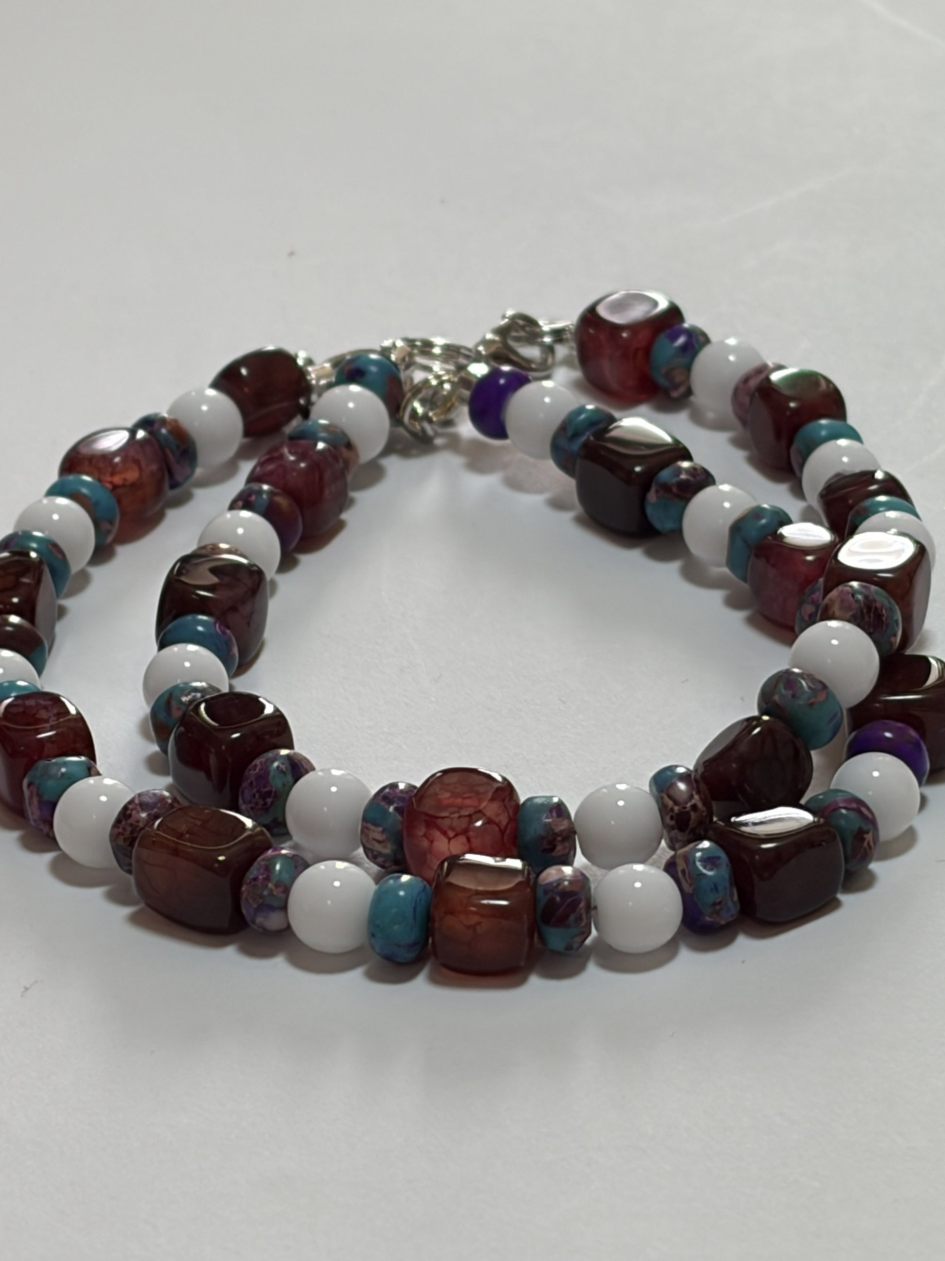 Purple stone couples bracelet set with 8mm agate beads, silver clasp, glossy white porcelain discs, and silver toggle clasp.