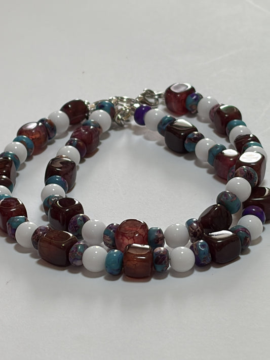 Purple stone couples bracelet set with 8mm agate beads, silver clasp, glossy white porcelain discs, and silver toggle clasp.