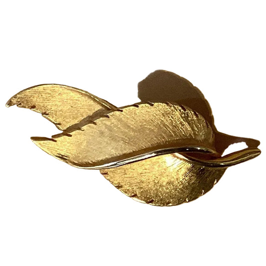 Gold feathers 2.5-inch brooch from Ysleta Mission Gift Shop, Catholic Christian jewelry accessory with feather design.