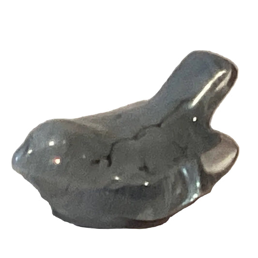 Grey glitter perched resin bird figurine, 2-inch mini craft and art creation accessory for dioramas and decorative projects.