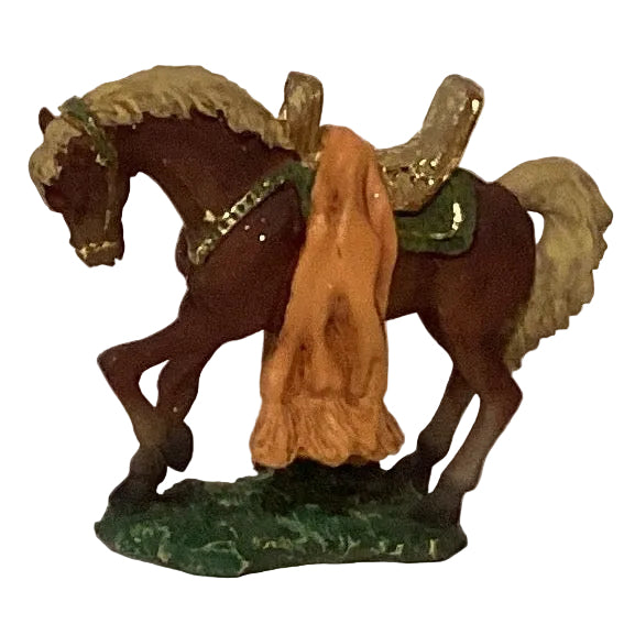Colorful ceramic Christmas figurines in assorted styles, perfect holiday decor from Ysleta Mission Gift Shop.