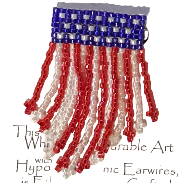 Beaded American flag cross earrings with patriotic design, featuring colorful beads and religious cross, crafted by Ysleta Mission Gift Shop.