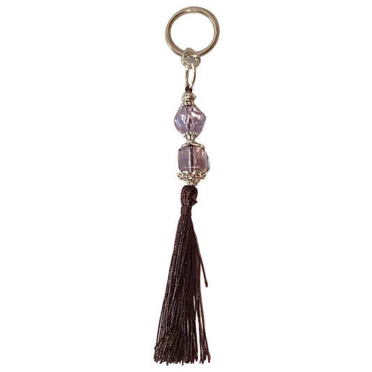 Purple crystal and tassel keychain with loop from Ysleta Mission Gift Shop, featuring vibrant purple crystals and decorative tassels.