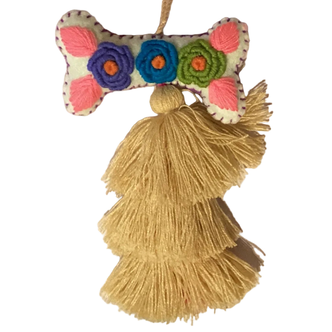Handcrafted Mexican embroidered dog bone charm tassel accessory by Jose Alberto Chavez, featuring colorful woven details and artisan craftsmanship.