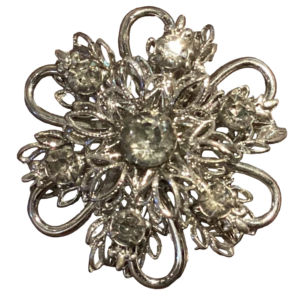 Silver-tone flower brooch with detailed floral design, 1.25 inches, crafted as a jewelry accessory with intricate metalwork.