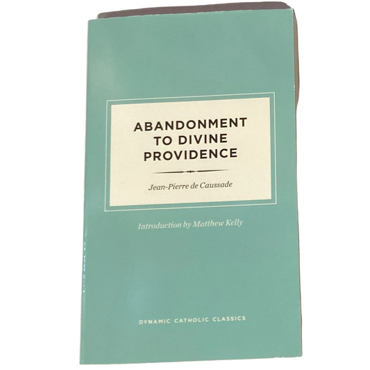 Open book titled "Abandonment to Divine Providence" from Ysleta Mission Gift Shop, Catholic faith and devotion Christian gift book.
