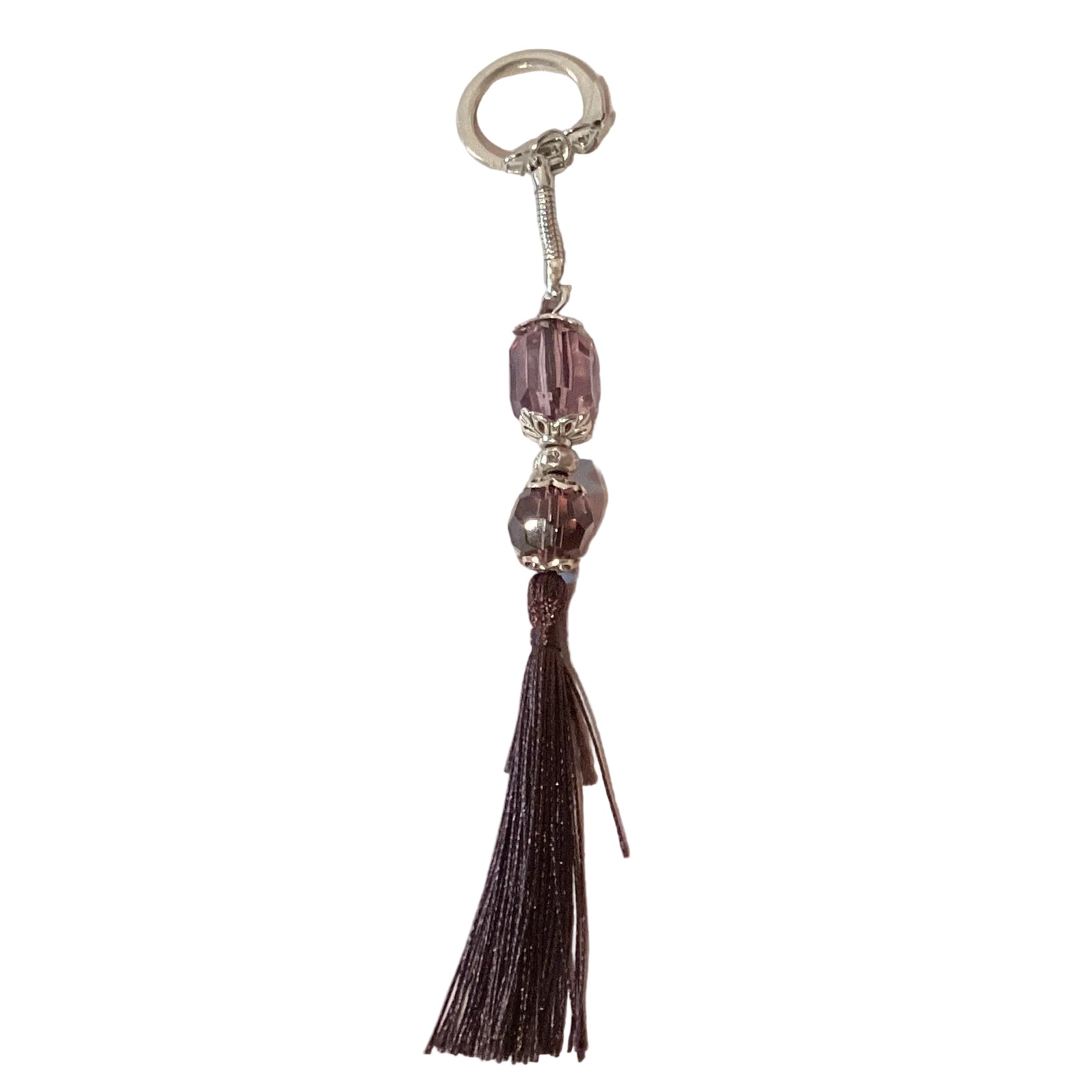 Purple crystal keychain with tassel, snap hook, and snake link, featuring a decorative and sparkling accessory from Ysleta Mission Gift Shop.