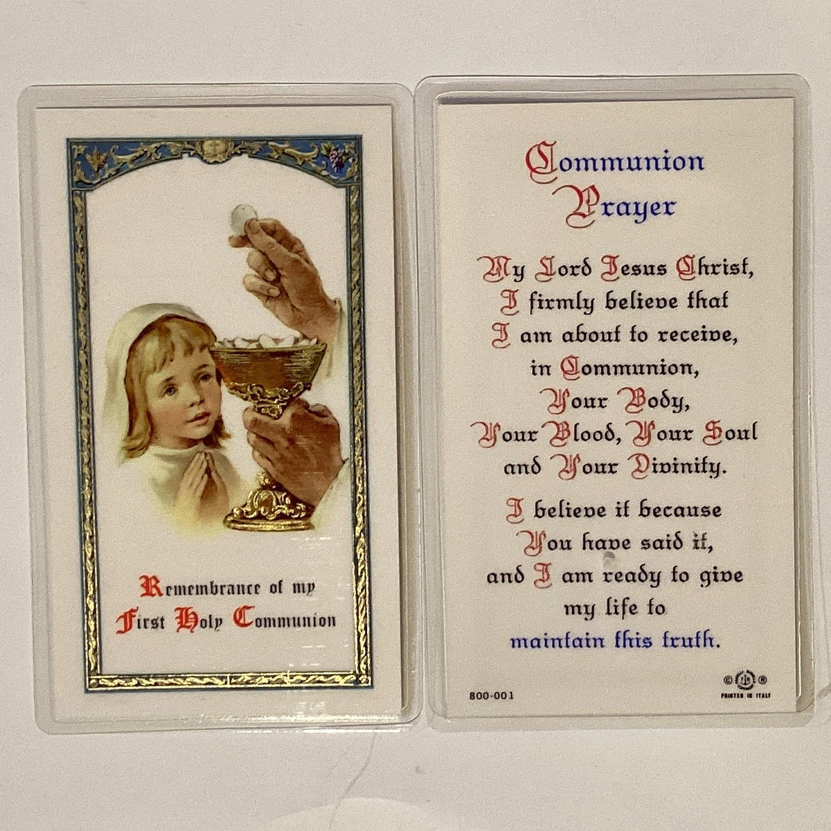 Laminated "Remember My First Communion" Catholic prayer card with religious text and artwork, designed for Christian First Communion ceremonies.