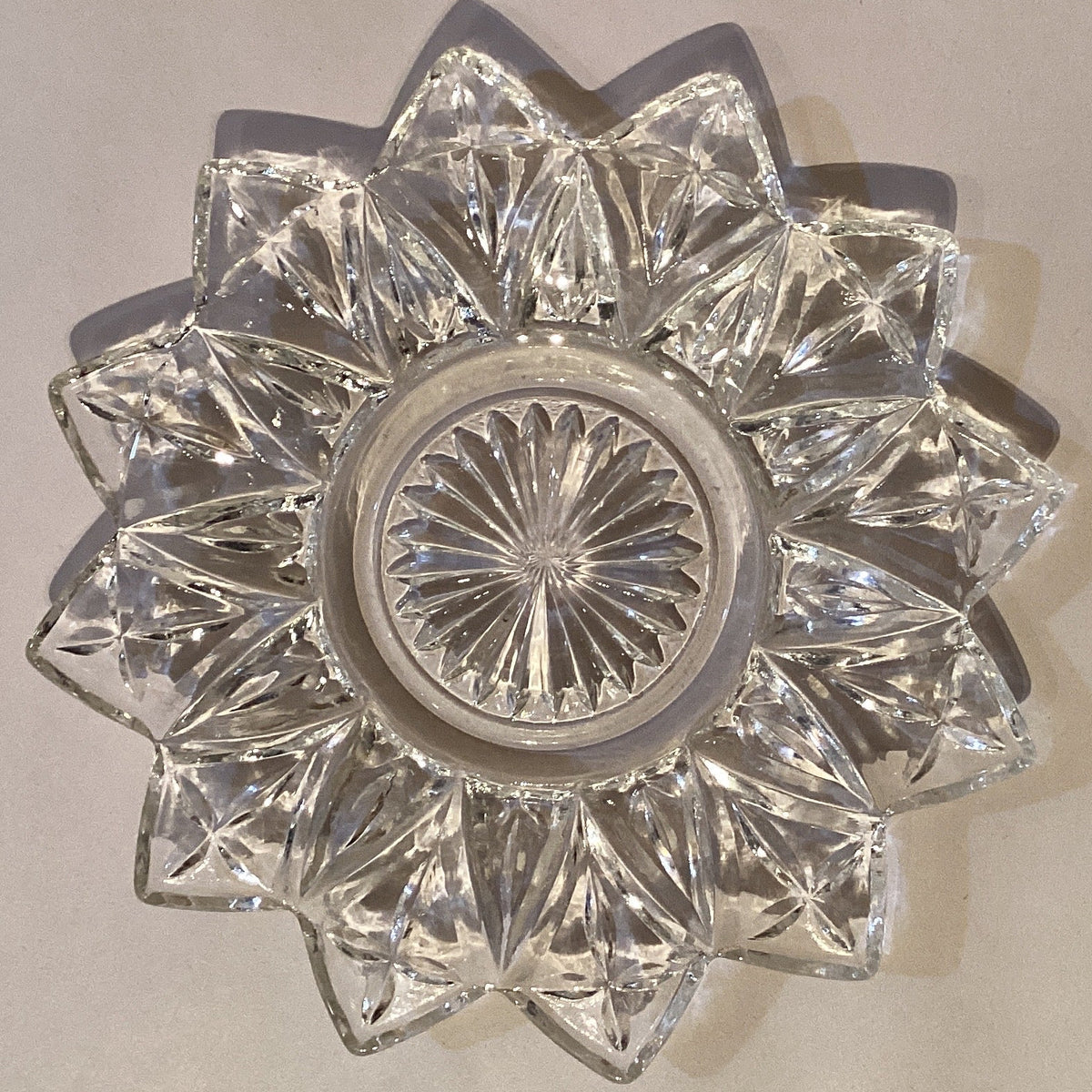 Decorative glass plate measuring 4 inches from Ysleta Mission Gift Shop, featuring colorful artistic design for home decor.