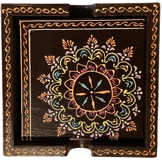 Colorful handcrafted wood mandala coaster set with folk art design, perfect for home and garden use, by Ysleta Mission Gift Shop.