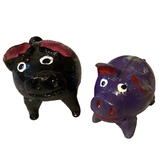 Cute pig figurine with floating tail, crafted for home and garden decor by Ysleta Mission Gift Shop.