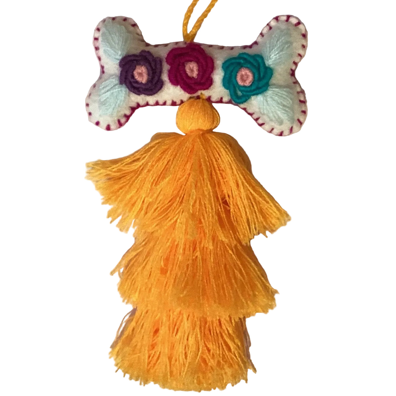 Handcrafted Mexican embroidered dog bone charm tassel accessory from Jose Alberto Chavez, featuring colorful embroidery and artisan details.
