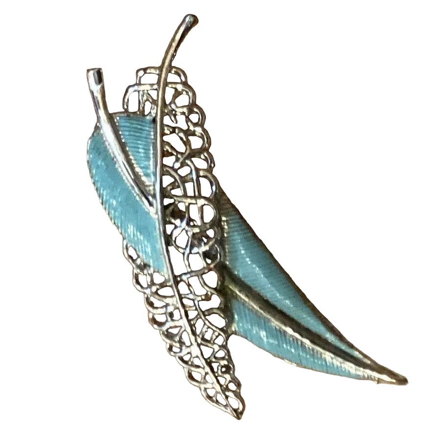 Silver and blue feather Catholic brooch featuring religious jewelry design, perfect for Christian gifts and accessories.