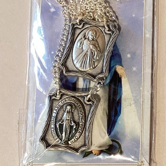 Silver metal Sacred Heart and Immaculate Conception Catholic scapular with prayer card, made in Italy, from Ysleta Mission Gift Shop.