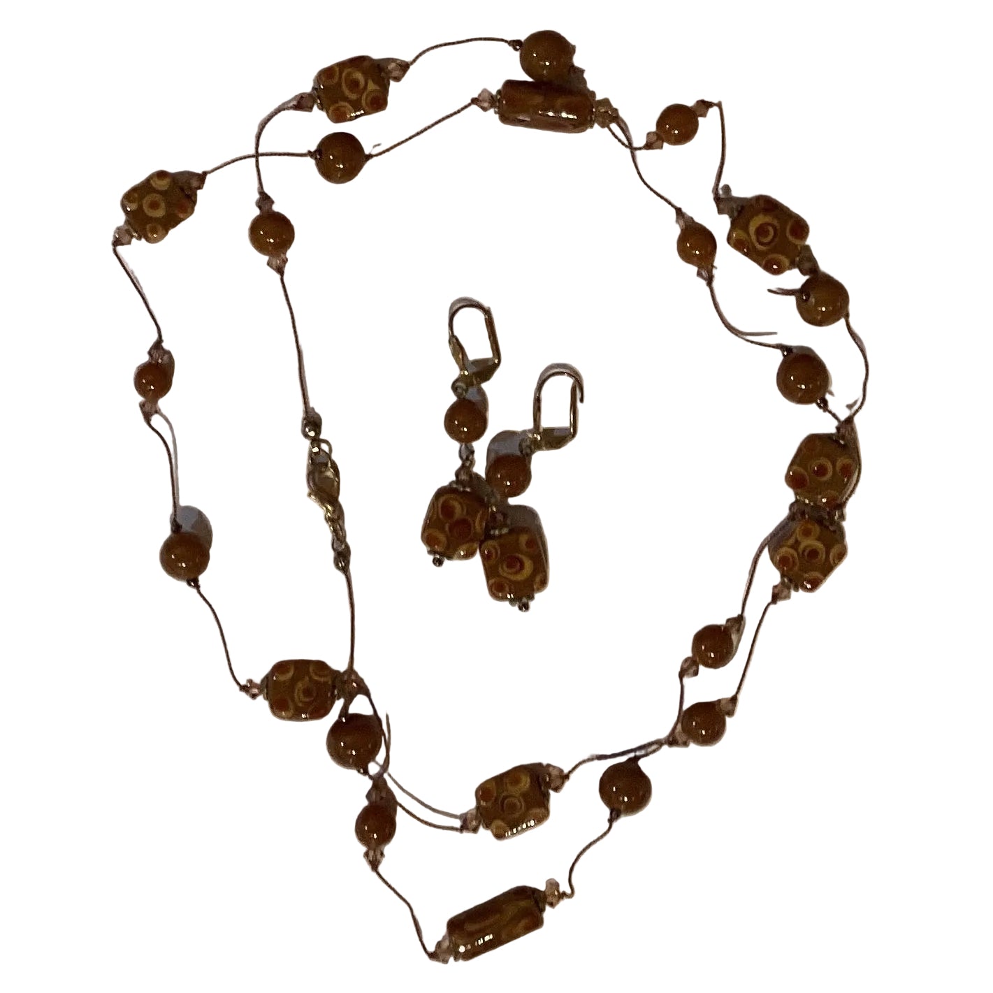 Beaded necklace and clasp earrings set featuring colorful beads and silver accents, 37-inch length, from Ysleta Mission Gift Shop.
