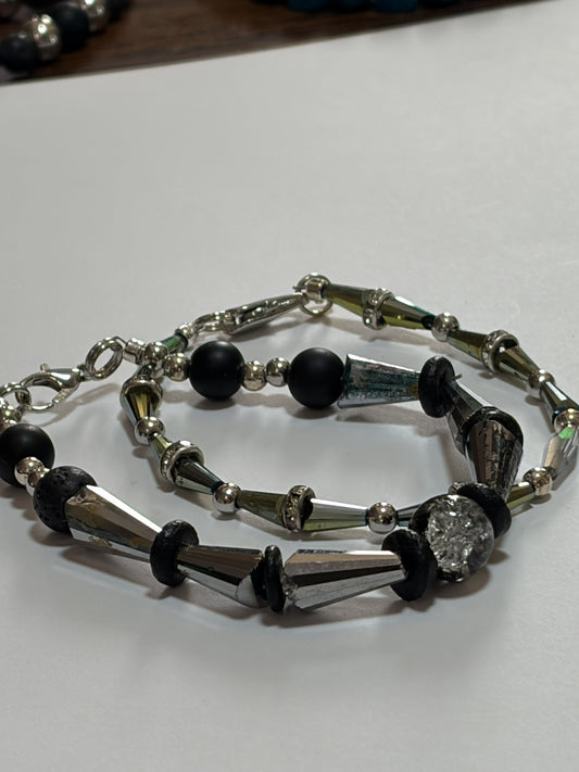 Silver beaded couples bracelet with 10mm natural stone, black onyx, silver spacers, and crackle glass beads, 20-inch length.
