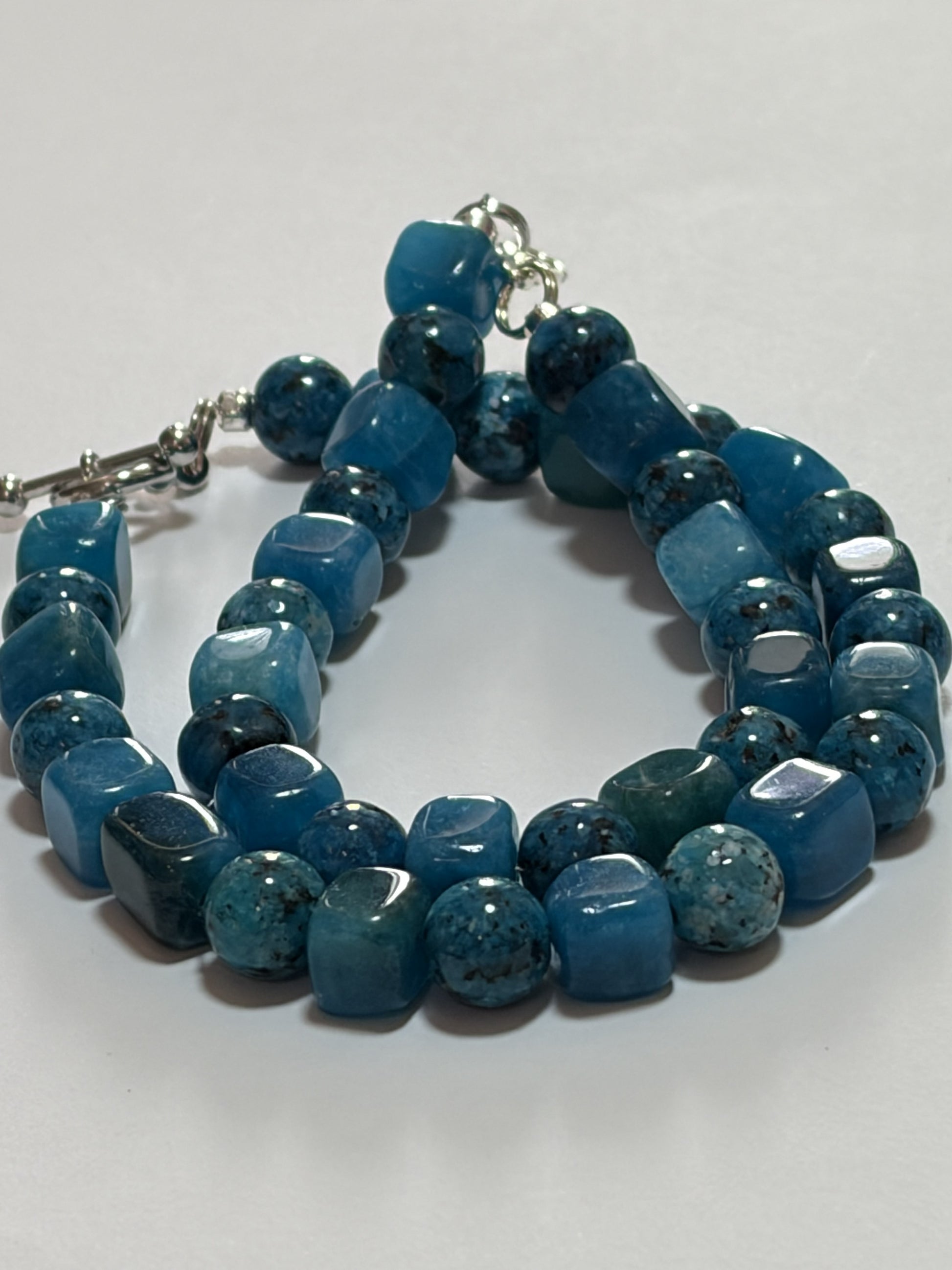 Sylvia Leroux classic pendant necklace with 20-inch chain, turquoise and jasper stones, silver lobster clasp, and toggle clasp detail.