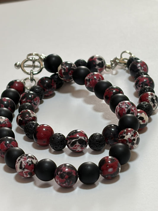 Natural stone bracelet set by Sylvia Leroux featuring 8mm black and red Jasper beads with silver lobster and toggle clasps for couples.