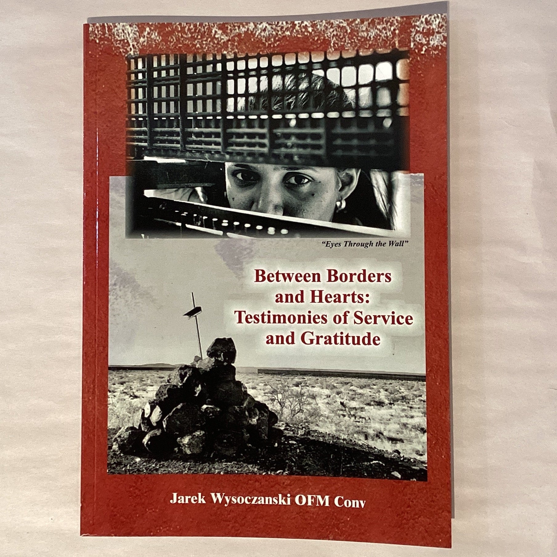 Cover of "Between Borders and Hearts" by Father Jarek Wysoczanski, a Catholic faith book with testimonies of service and gratitude.