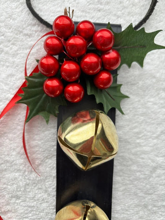 Black leather bell hanger with gold Christmas bells and holiday dÃ©cor
