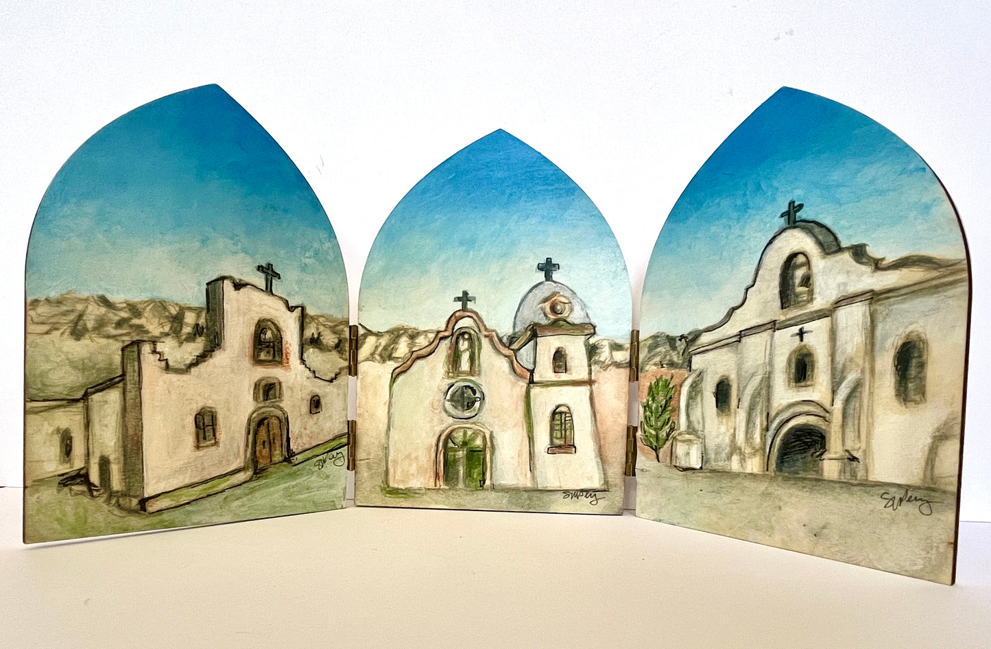 Front view of Susan W Perez's Mission Trail wooden screen featuring original El Paso artwork with a blue sky design.