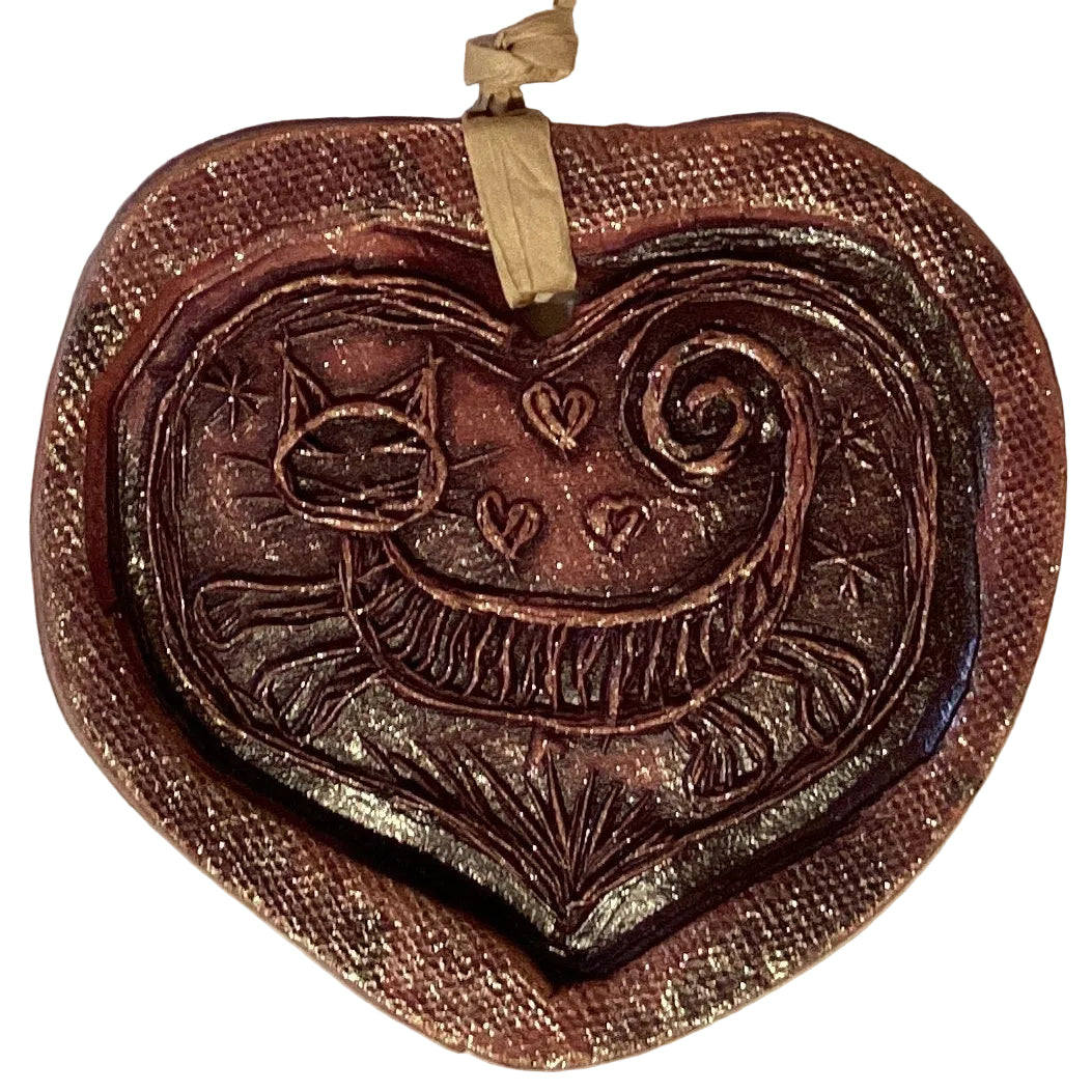 Handmade clay 4-inch decorative ornaments featuring colorful designs, suitable for home and garden decor from Ysleta Mission Gift Shop.