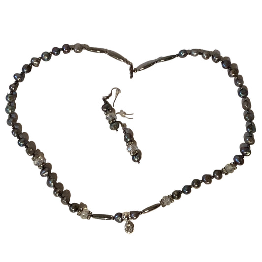 Silver beaded jewelry set with matching earrings and a 26-inch beaded necklace, featuring intricate beadwork and silver accents.