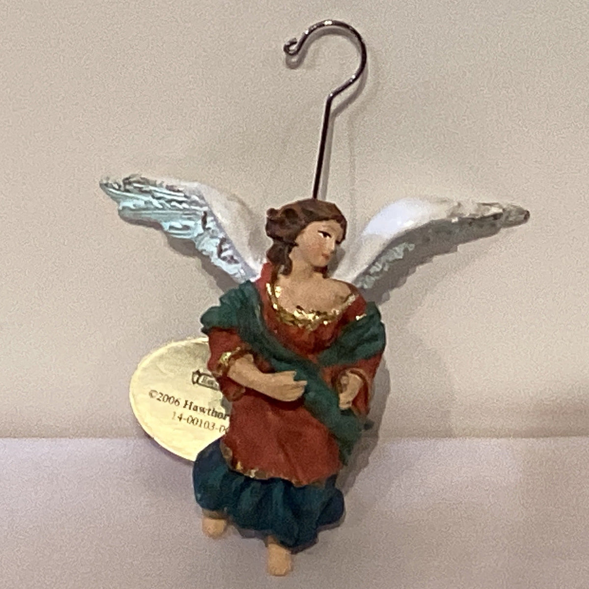 Assorted ceramic Christmas figurines, 3 inches tall, featuring holiday-themed designs from Ysleta Mission Gift Shop.