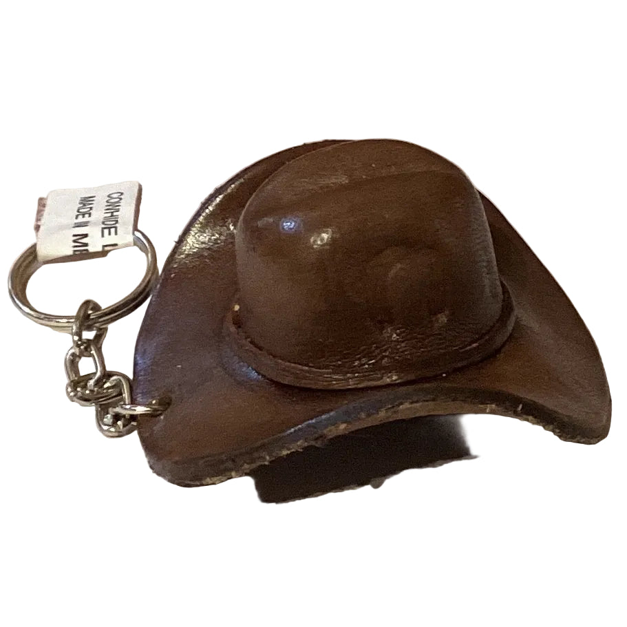 Mini leather cowboy hat keychain with Western Texas style, featuring detailed stitching and a small metal keyring attachment.