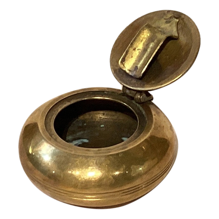 Vintage brass-tone travel ashtray with hinged lid and resting lip, perfect for home or outdoor use, by Ysleta Mission Gift Shop.