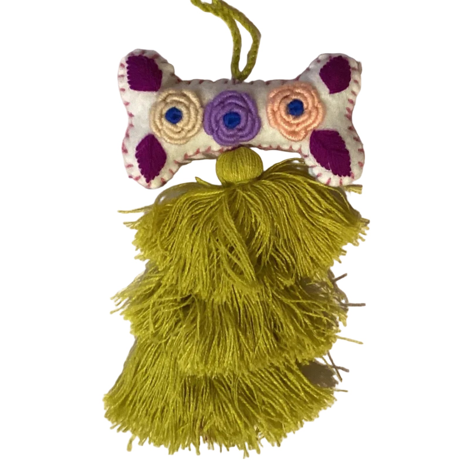 Handcrafted Mexican embroidered dog bone charm with tassel, artisan accessory from Jose Alberto Chavez, featuring vibrant traditional embroidery.