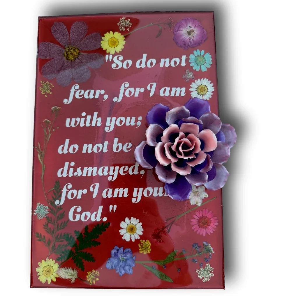 Decorative scripture plaque by Brigitte Rosson featuring resin and dried flowers with a Bible verse for wall art.