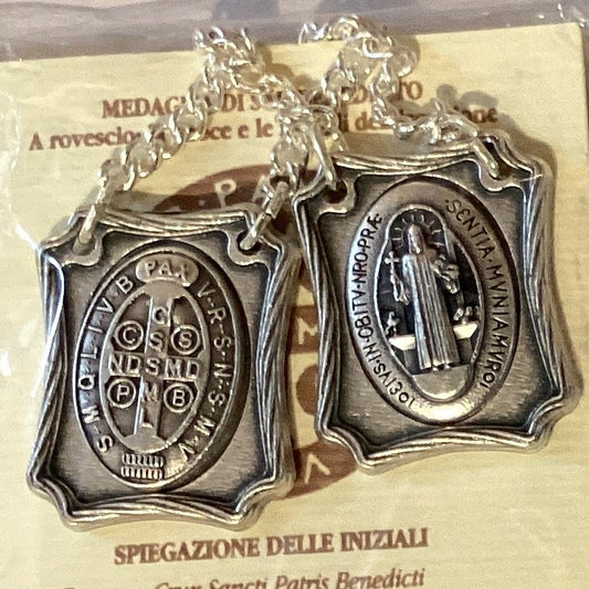 Silver Saint Benedict protection scapular with prayer card, Catholic Christian gift made in Italy, featuring detailed religious design.