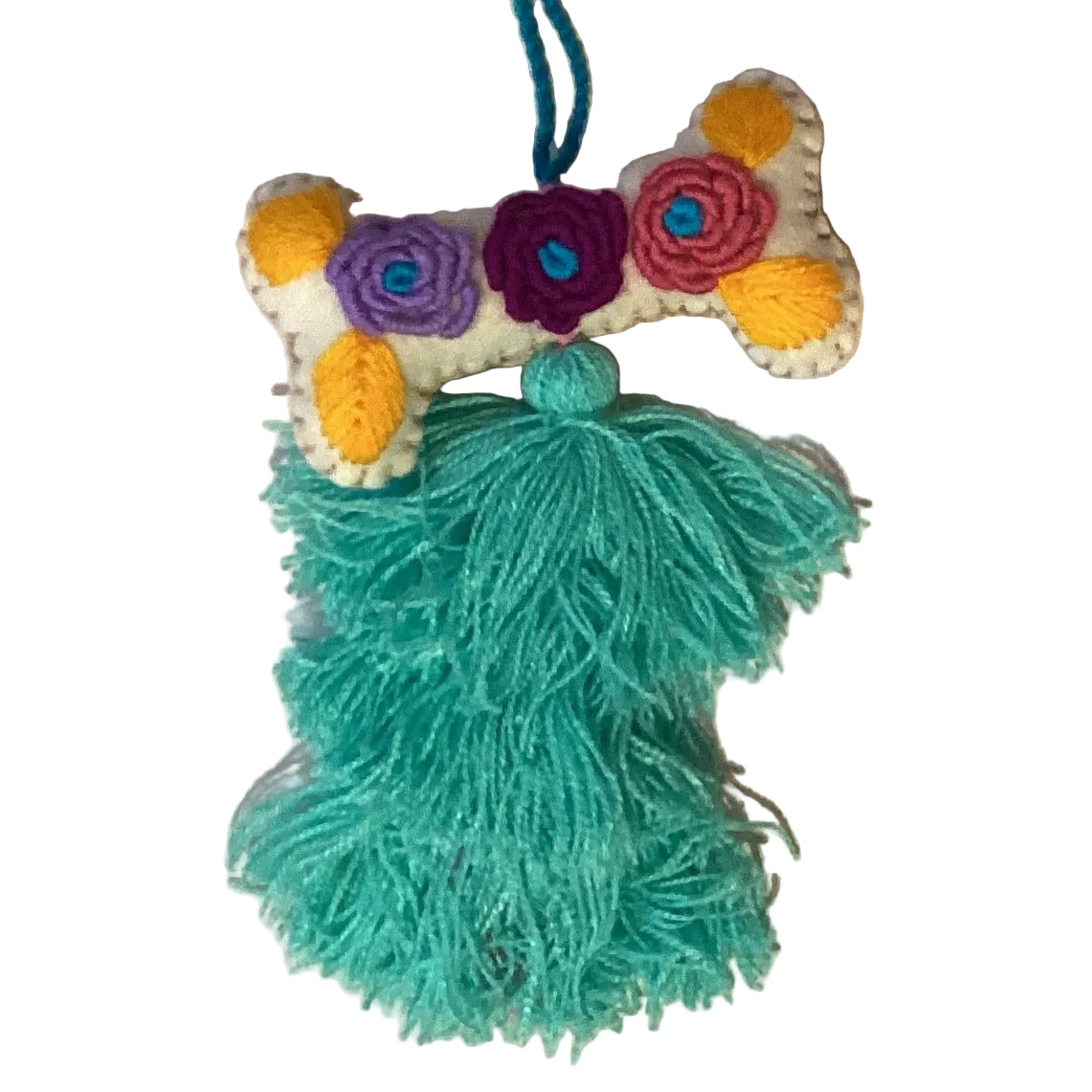 Handcrafted Mexican embroidered dog bone charm with tassel, artisan accessory from Jose Alberto Chavez, designed for bag decoration.