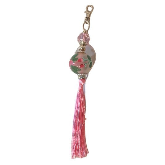 Pink rose charm and tassel keychain with lobster clasp, handcrafted decorative accessory from Ysleta Mission Gift Shop.