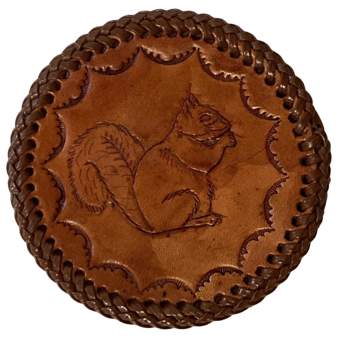 Leather embossed 3.5-inch coasters with intricate design, crafted by Ysleta Mission Gift Shop for a stylish home decor accent.