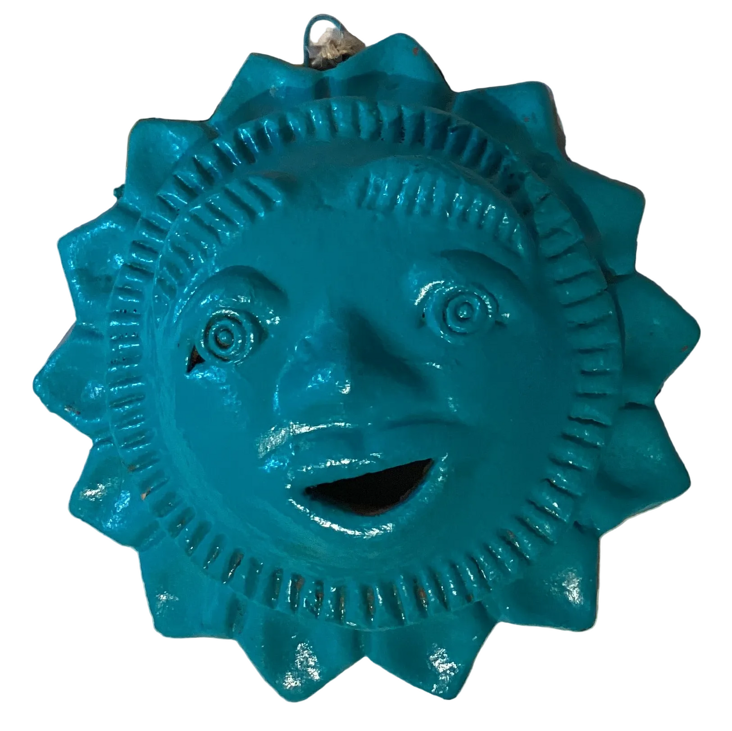 Turquoise clay sun wall decor with textured surface and vibrant color, perfect for boho or southwestern interior design.