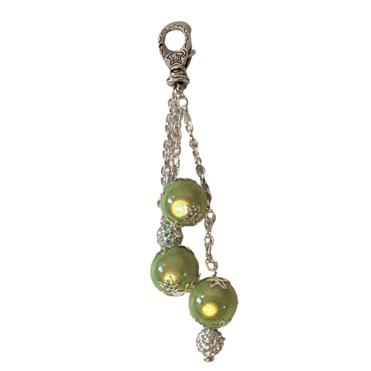 Green charm keychain with lobster clasp featuring colorful beads and metal accents, perfect for attaching to keys or bags.