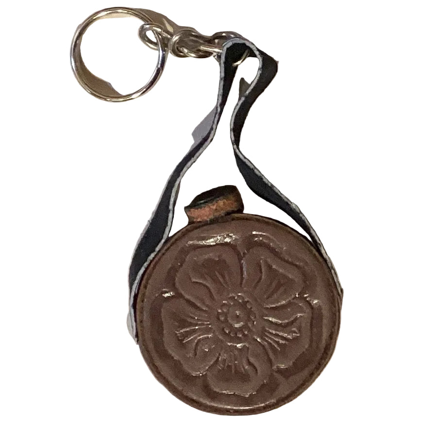 Leather keychain with "El Paso" engraved, featuring a 1-inch Ysleta Mission design, from Ysleta Mission Gift Shop.