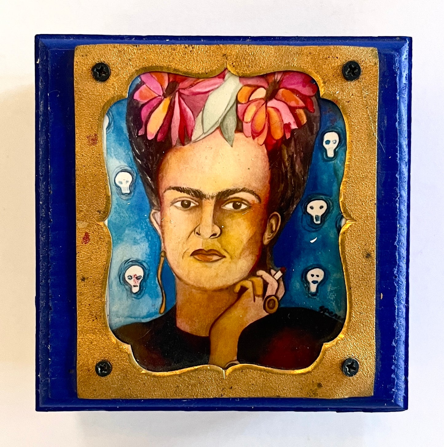 Overhead view of a Frida-inspired wooden trinket box with colorful art print, decorative home and garden storage by Susan W Perez.