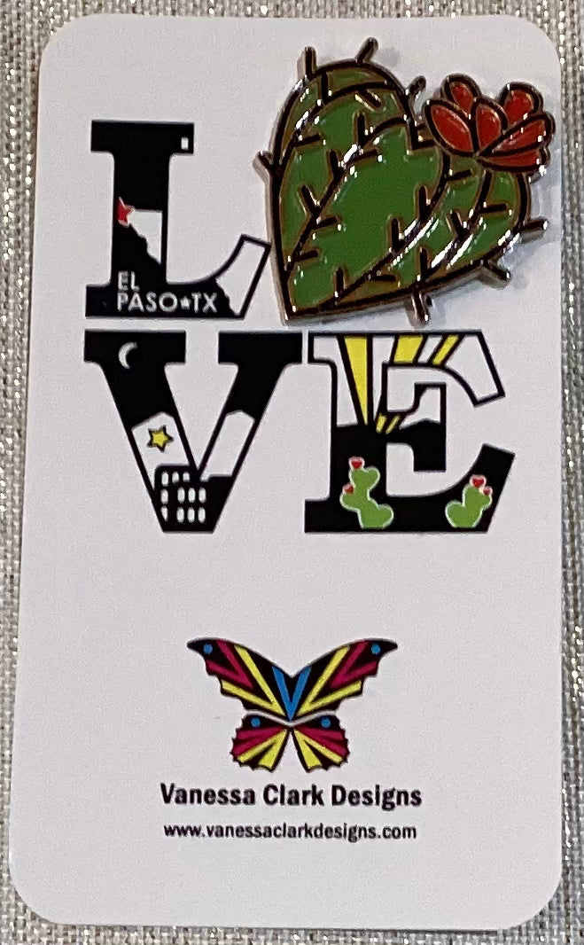 Vanessa Clark enamel pin featuring a barrel cactus design, showcasing vibrant colors and detailed craftsmanship as a jewelry accessory.